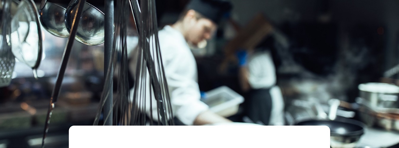 Professional kitchen with chef and equipment