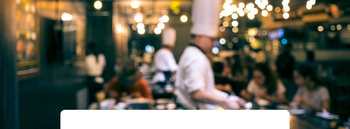 Show kitchen with chef and guests